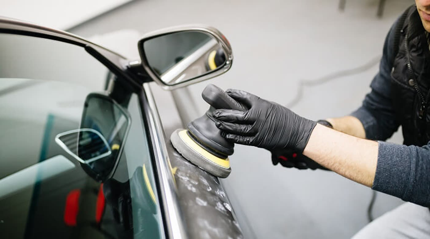 Machine polishing a car's paintwork during a Coleman's detail