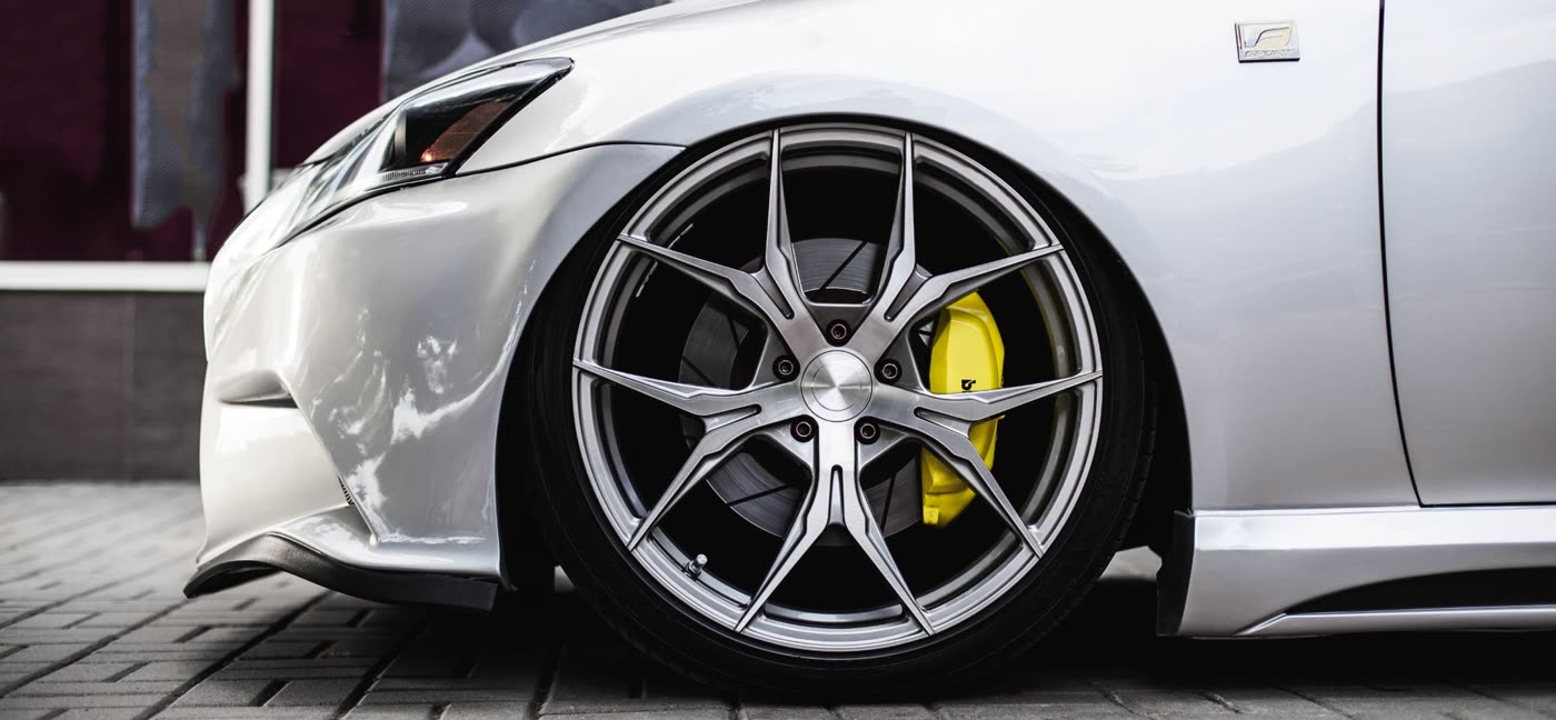 Freshly cleaned alloy wheel with yellow brake caliper